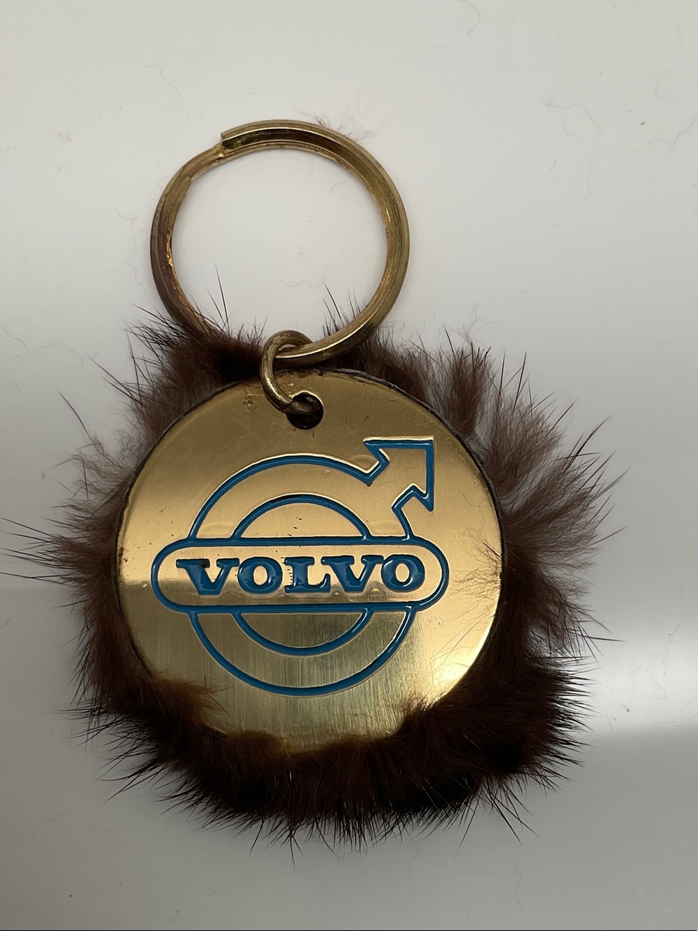 Volvo Gold-Tone Logo Keychain with Brown Fur Trim